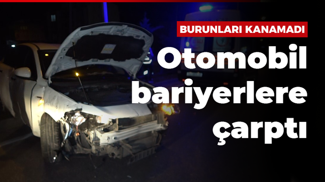 Bariyerlere çarpan otomobilden yara almadan çıktılar