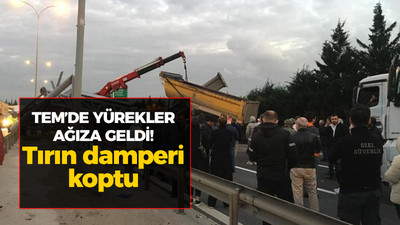 Kocaeli haber - TEM'de yürekler ağıza geldi! Tırın damperi koptu