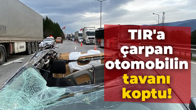 TIR'a çarpan otomobilin tavanı koptu!