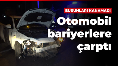 Bariyerlere çarpan otomobilden yara almadan çıktılar