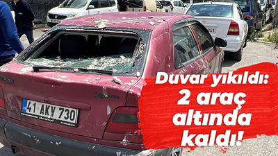 Duvar yıkıldı: 2 araç altında kaldı!