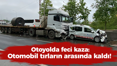 Otoyolda feci kaza: Otomobil tırların arasında kaldı!